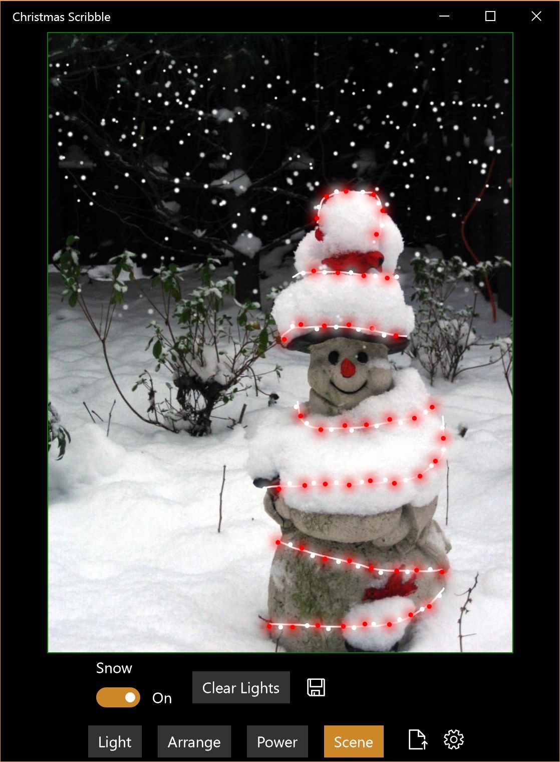 A lonely snowman warmed by some peppermint-colored lights and cozy snow.