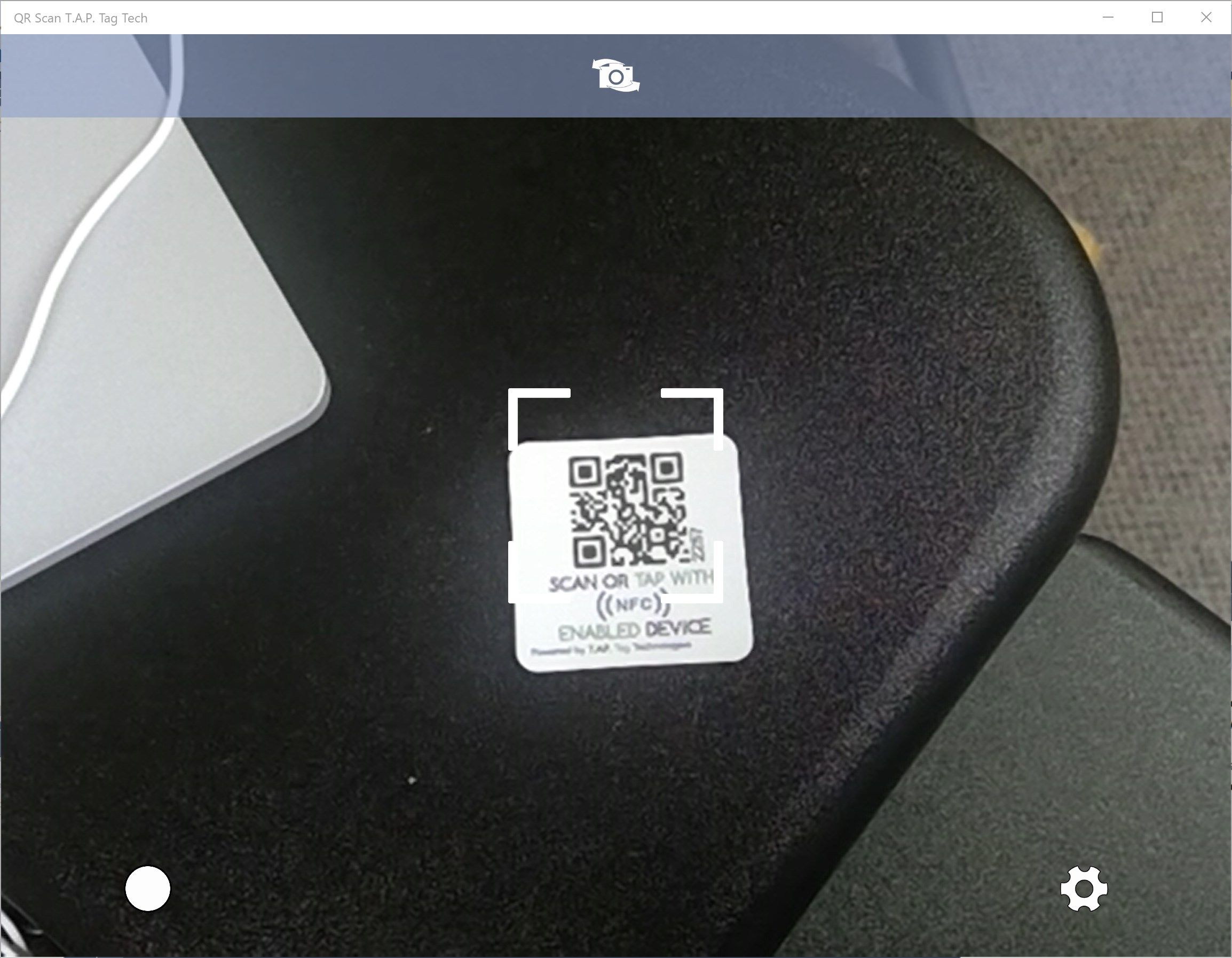 Simply point the aimer at the QR code, and the app will automatically open the content!
