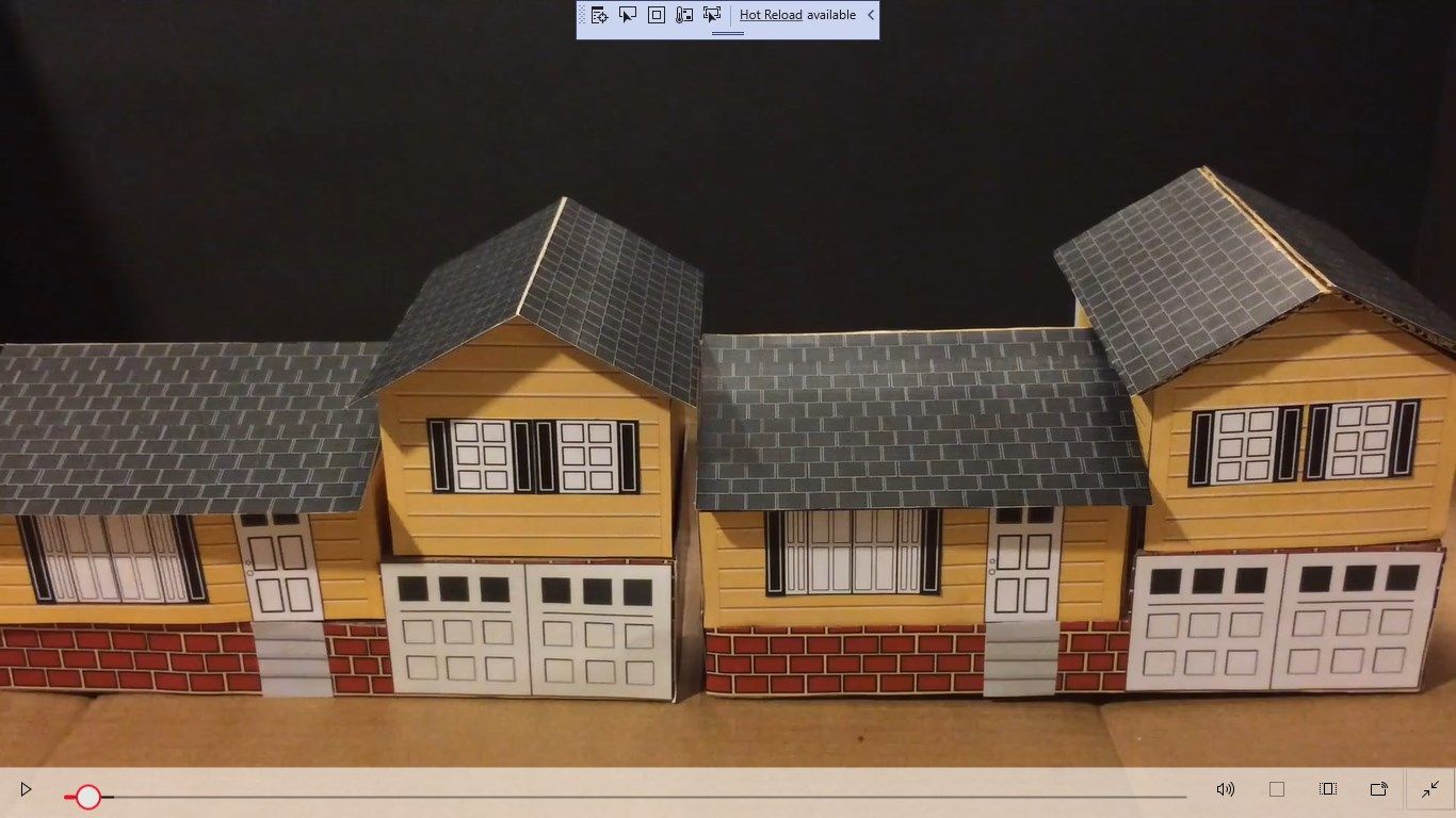 Finished paperboard(left) and cardboard model house